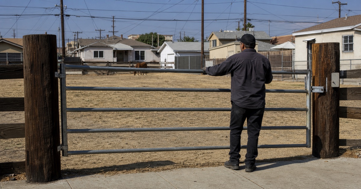 Wide galvanized farm gate on a large Richland Farms lot in Compton, CA